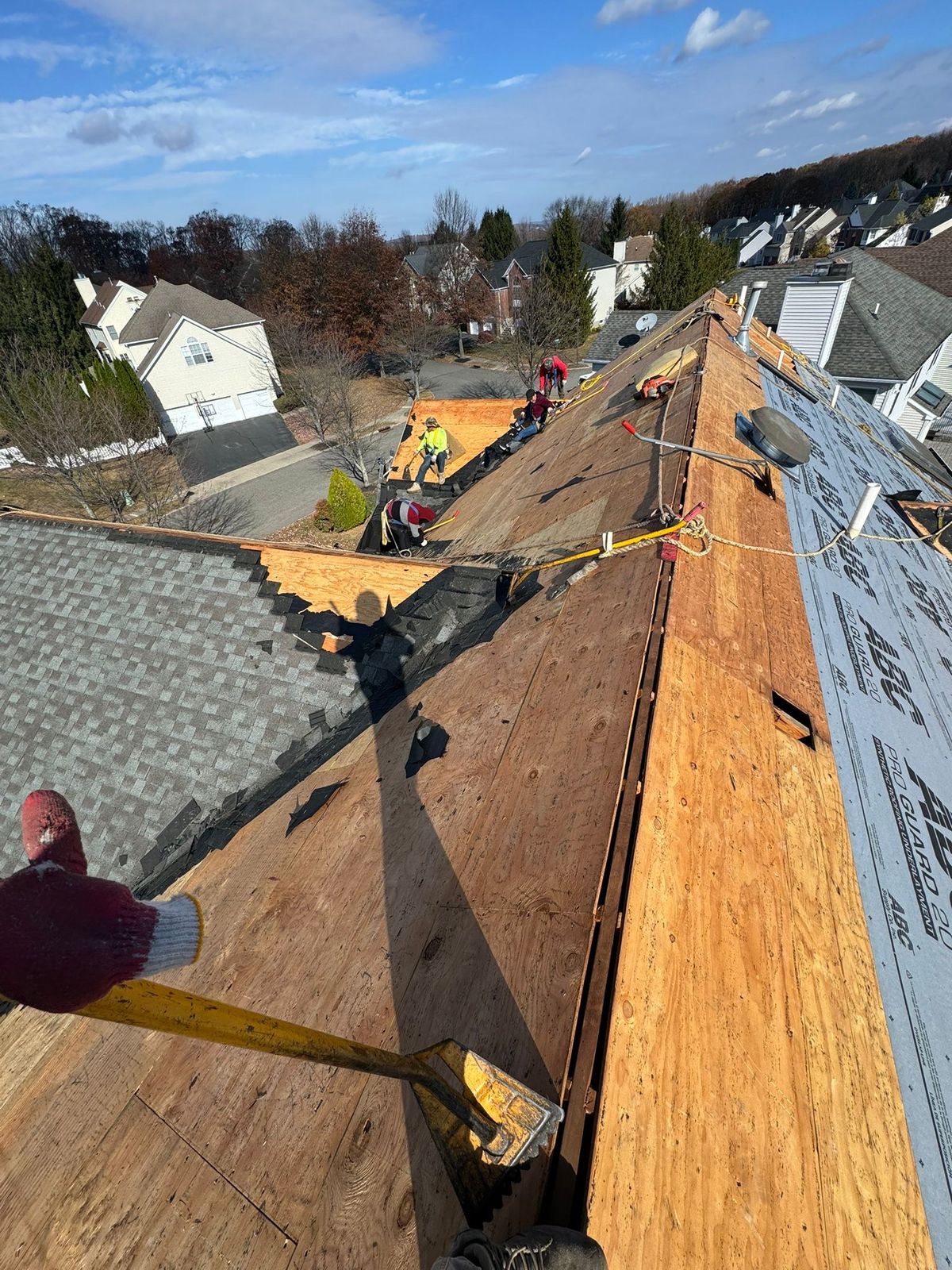 Roof before — strip and re-deck in progress